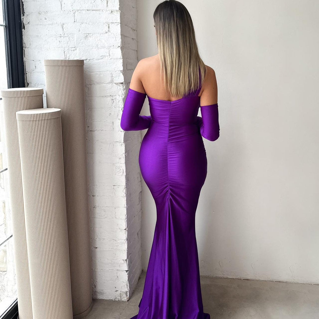 back view of woman in purple off shoulder gown back view of woman in purple off shoulder gown