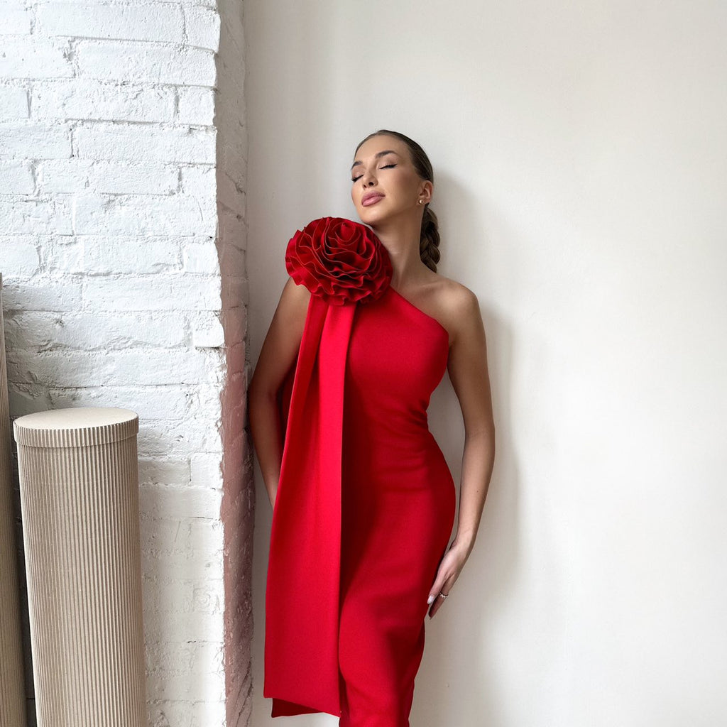 woman wearing red one shoulder dress with floral detail woman wearing red one shoulder dress with floral detail