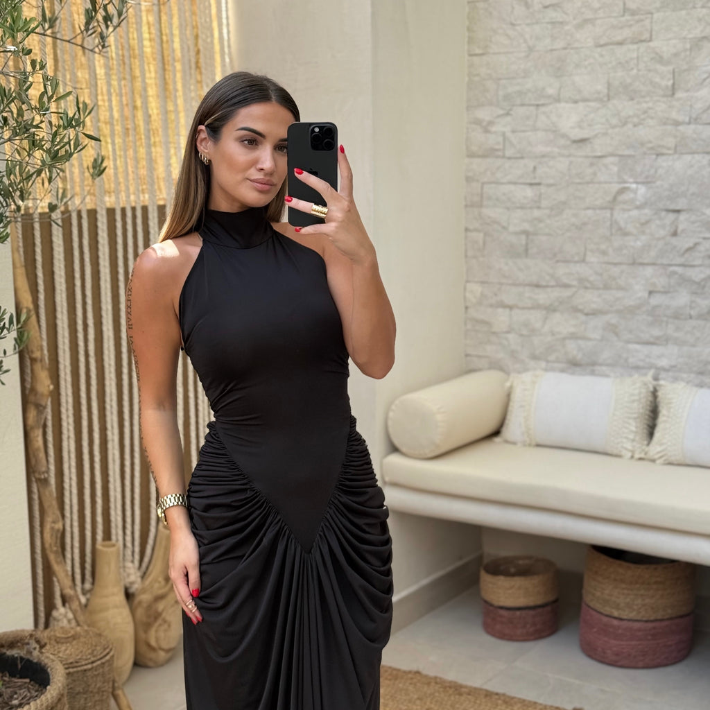 woman wearing elegant black maxi dress in modern room woman wearing elegant black maxi dress in modern room