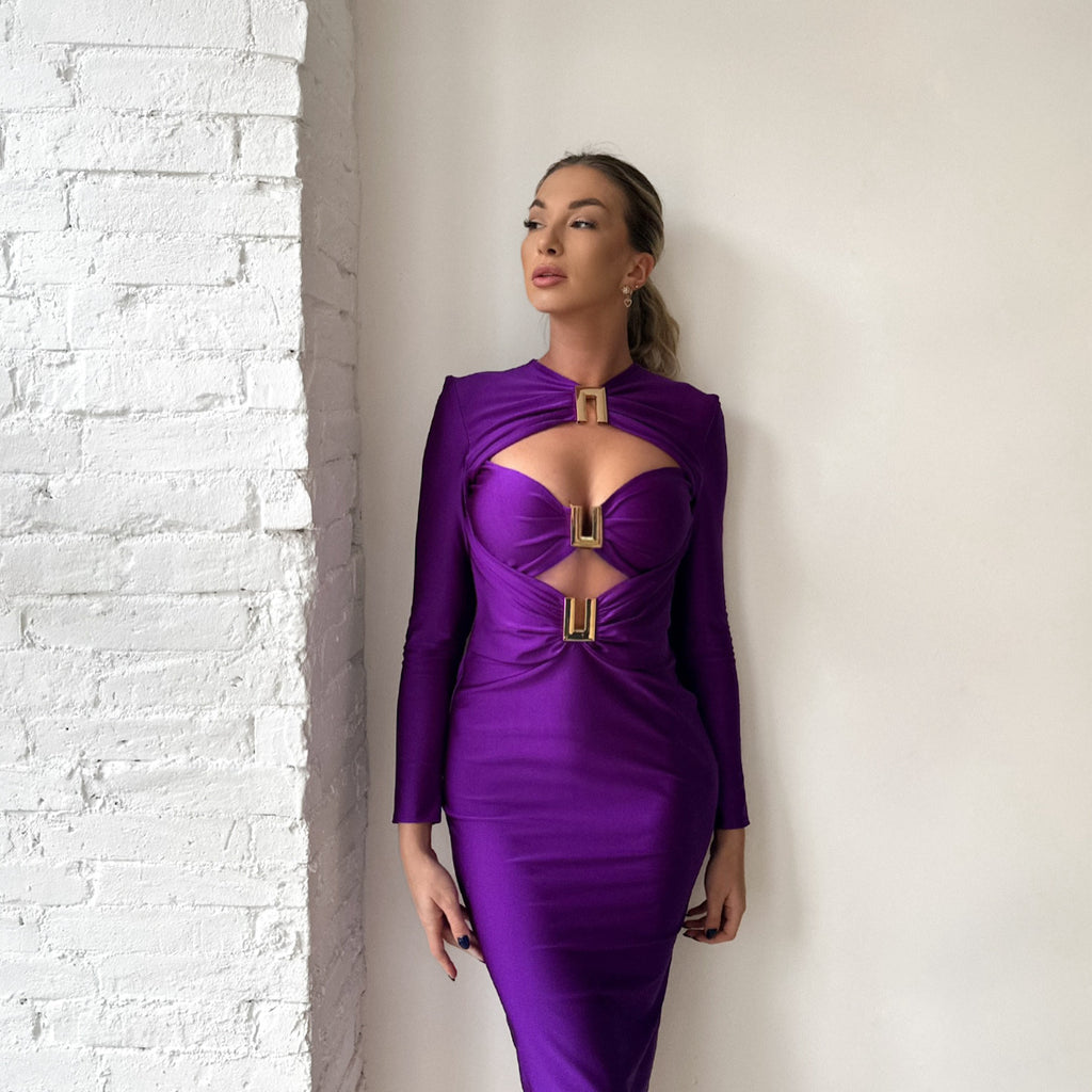 woman wearing purple dress with geometric cutouts woman wearing purple dress with geometric cutouts