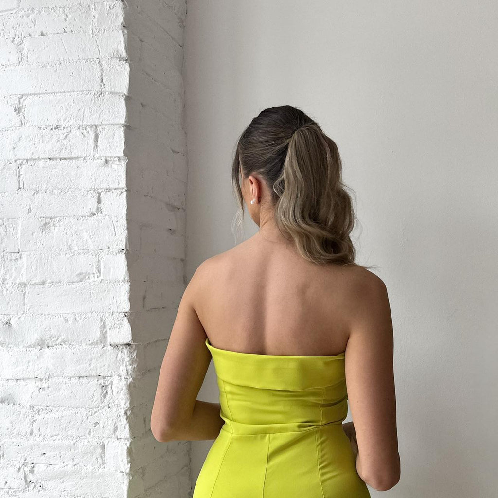 woman in strapless yellow dress woman in strapless yellow dress