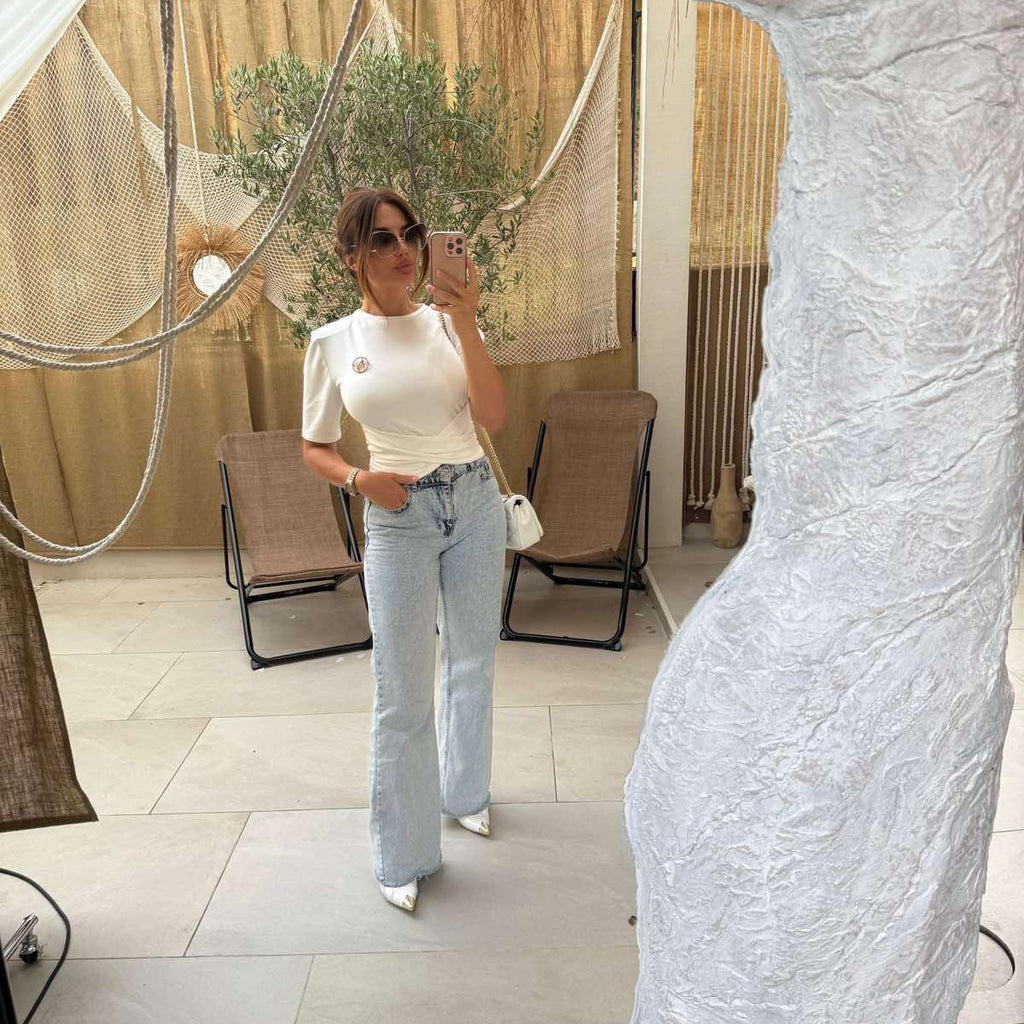 selfie in mirror woman in white top and jeans selfie in mirror woman in white top and jeans