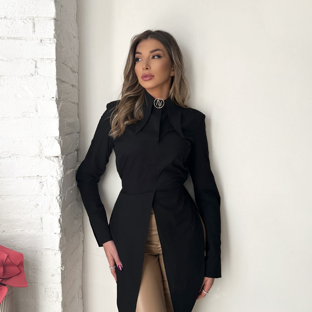woman wearing elegant black dress and tan pants woman wearing elegant black dress and tan pants