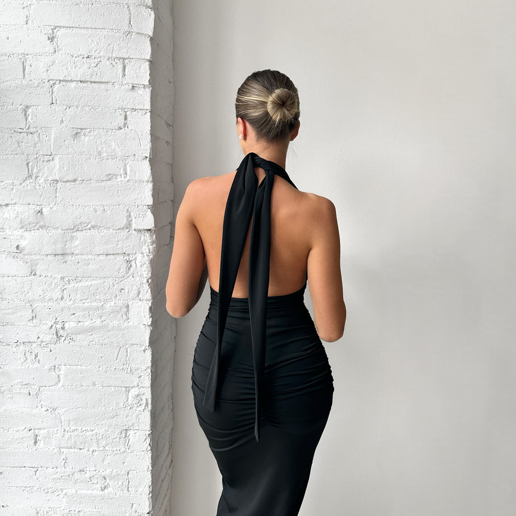 black backless halter dress with bow detail black backless halter dress with bow detail