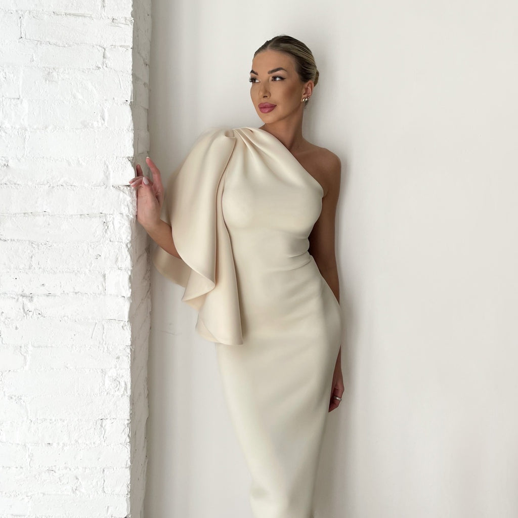 woman in cream one shoulder dress woman in cream one shoulder dress