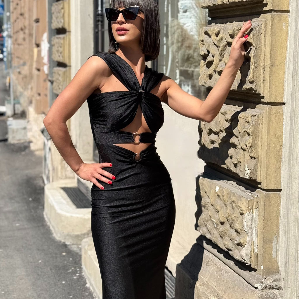 woman in elegant black cutout dress outdoors woman in elegant black cutout dress outdoors