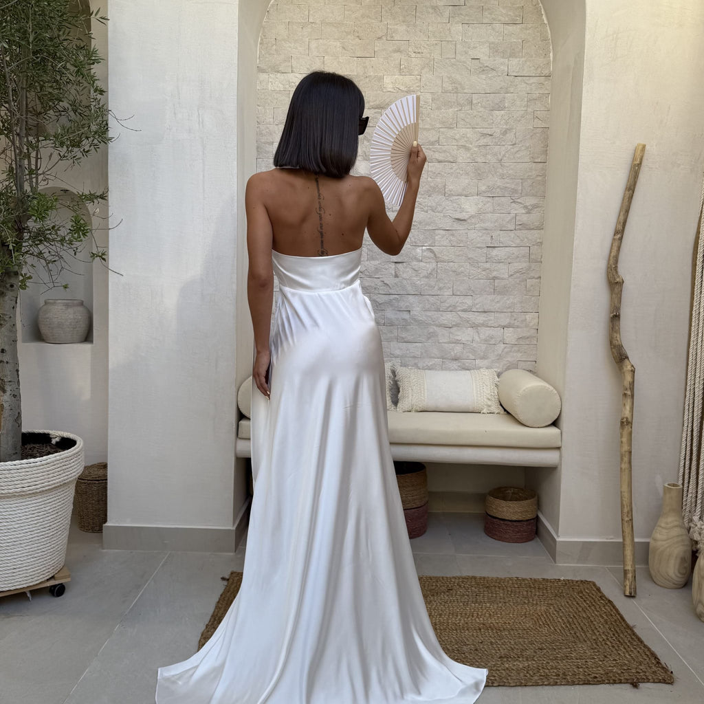woman in silk strapless dress holding hand fan woman in silk strapless dress holding hand fan