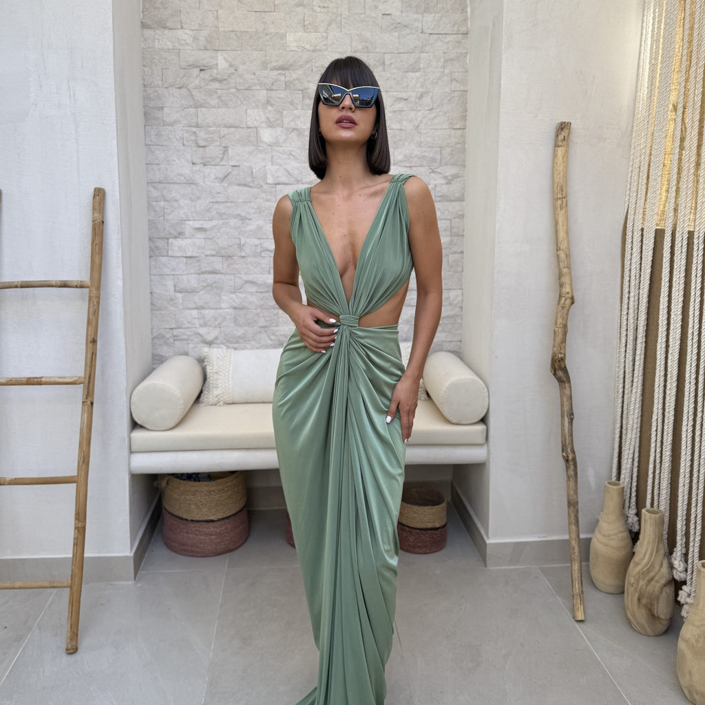 woman in elegant green dress and sunglasses woman in elegant green dress and sunglasses