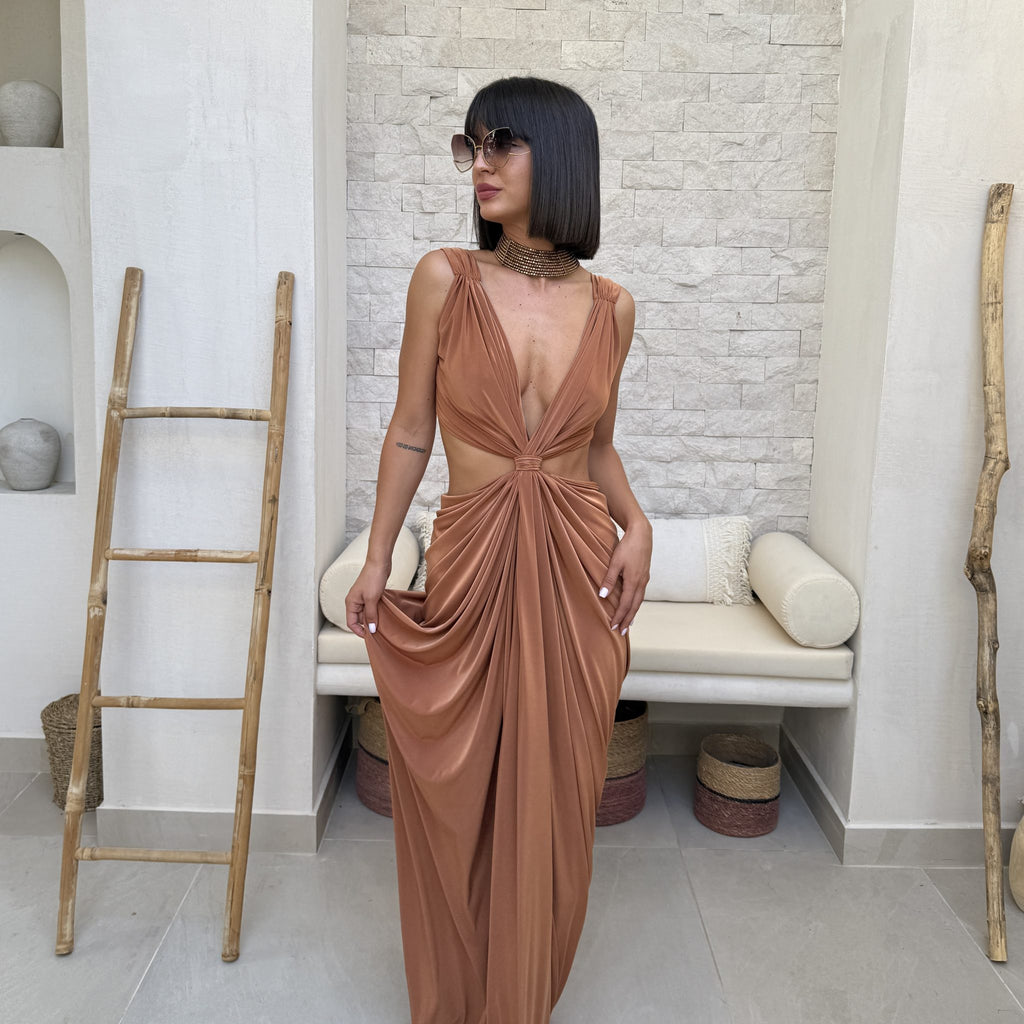 woman in elegant brown dress with cutouts woman in elegant brown dress with cutouts