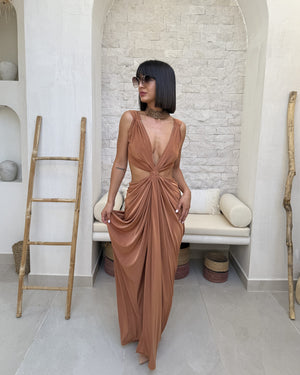 woman in elegant brown dress with cutouts woman in elegant brown dress with cutouts