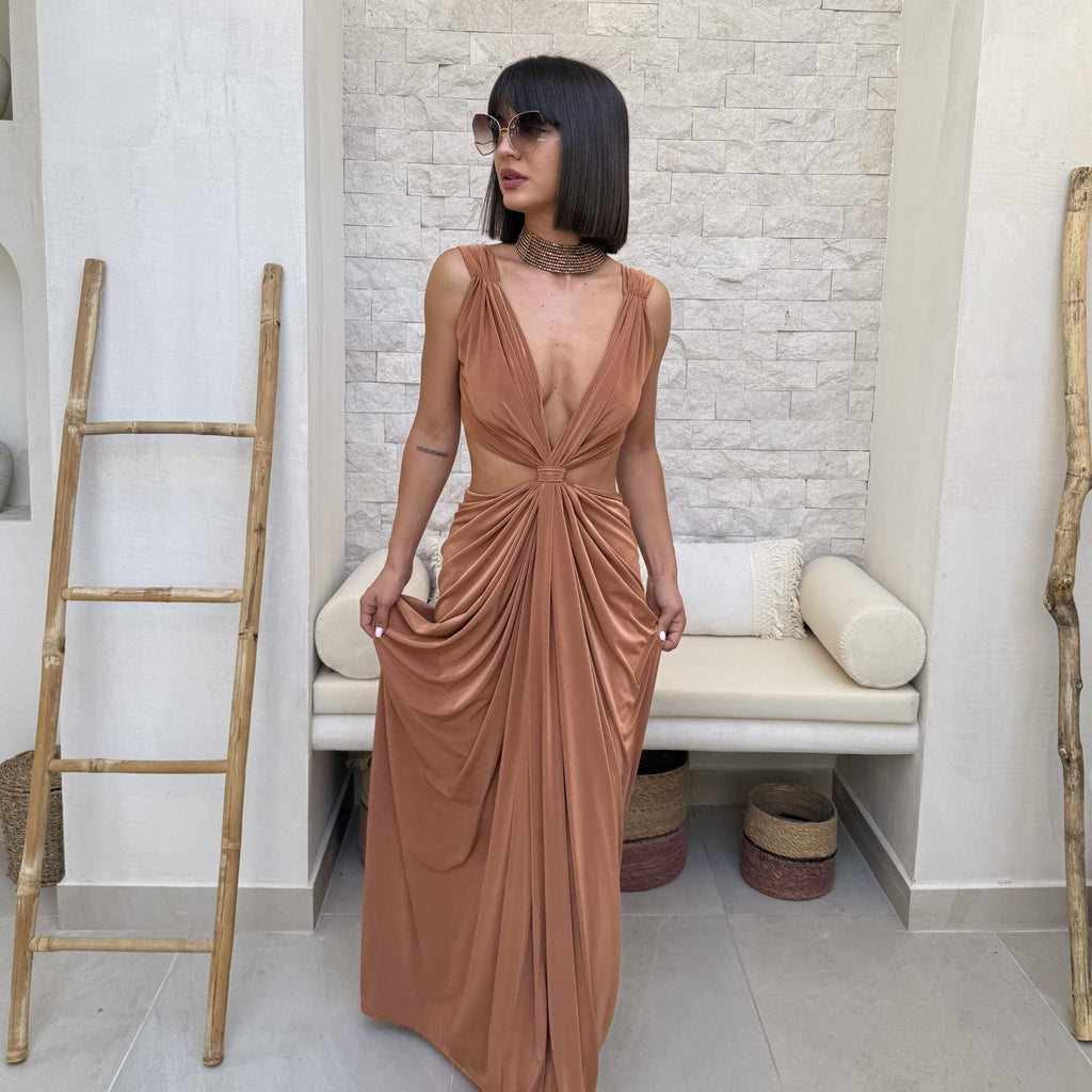 woman in elegant brown dress with pleated details woman in elegant brown dress with pleated details