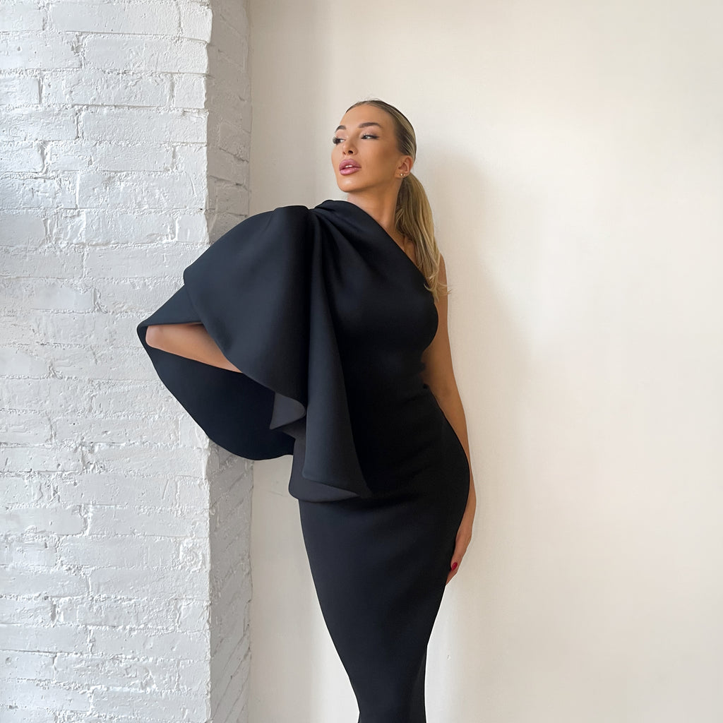sleeveless black dress with dramatic shoulder bow sleeveless black dress with dramatic shoulder bow
