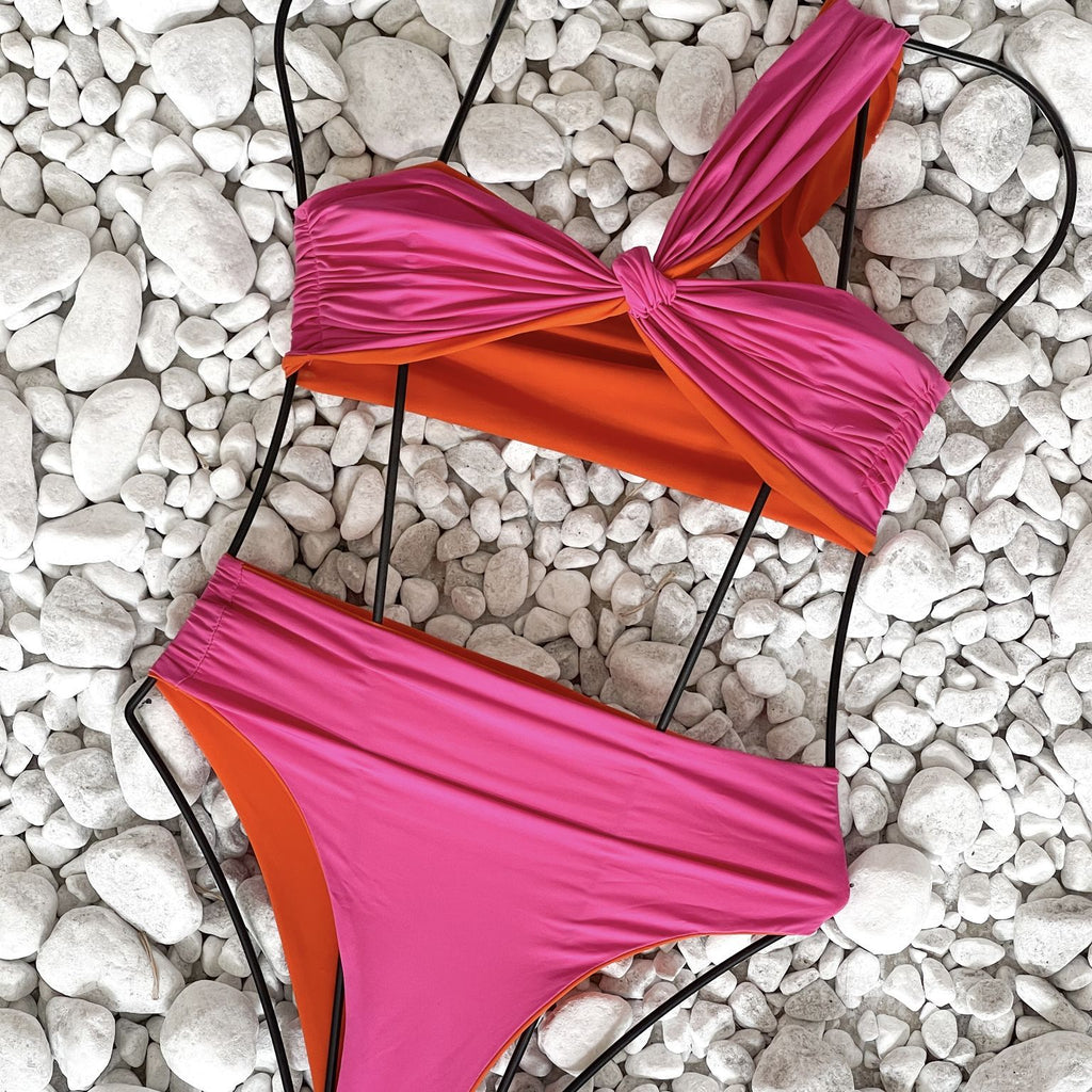 pink and orange bikini on white pebbles pink and orange bikini on white pebbles
