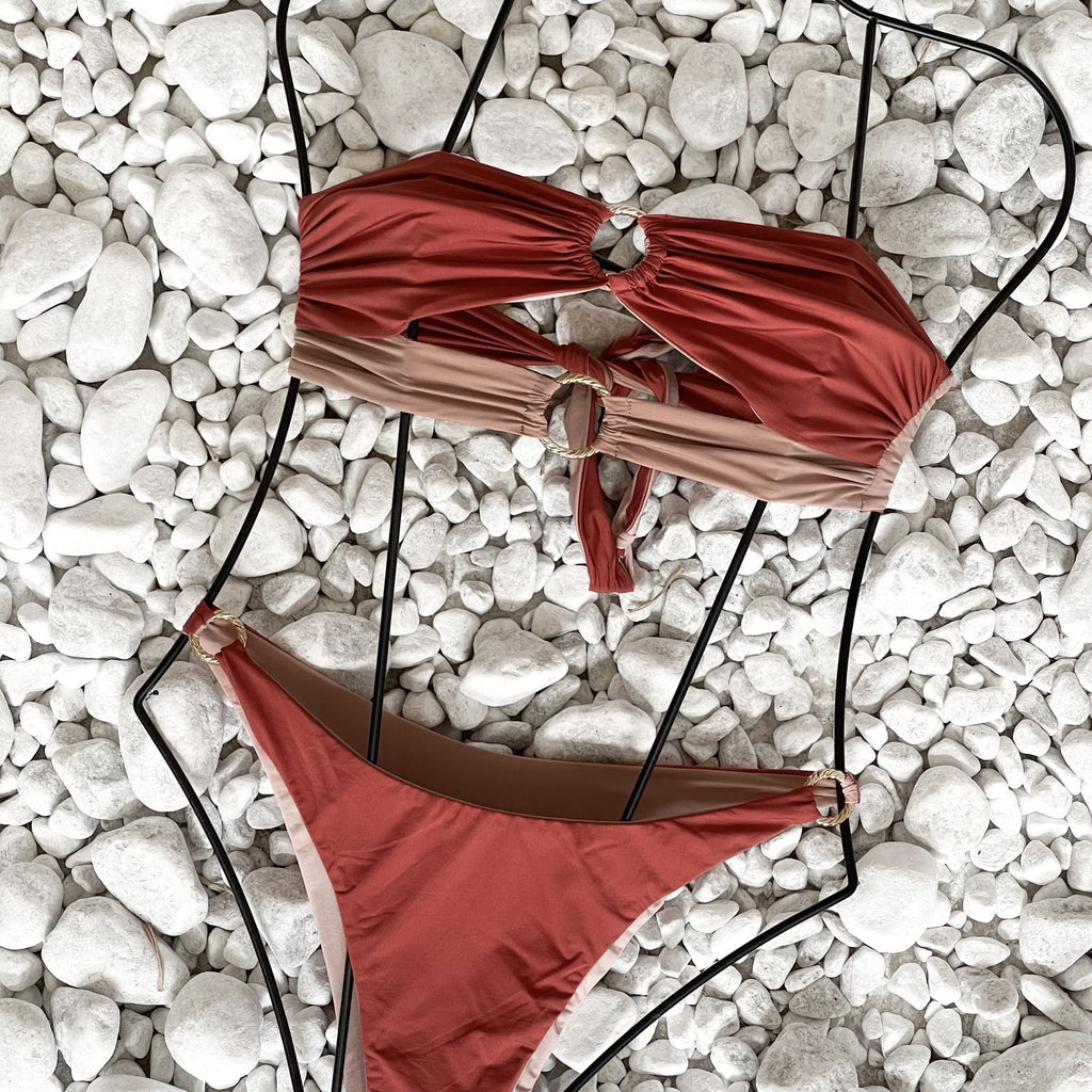 red and beige bikini on white stones red and beige bikini on white stones