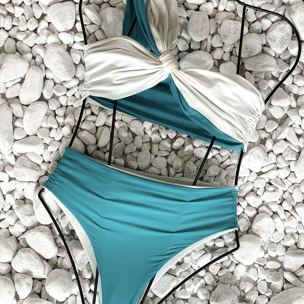 turquoise and white bikini on white pebbles turquoise and white bikini on white pebbles