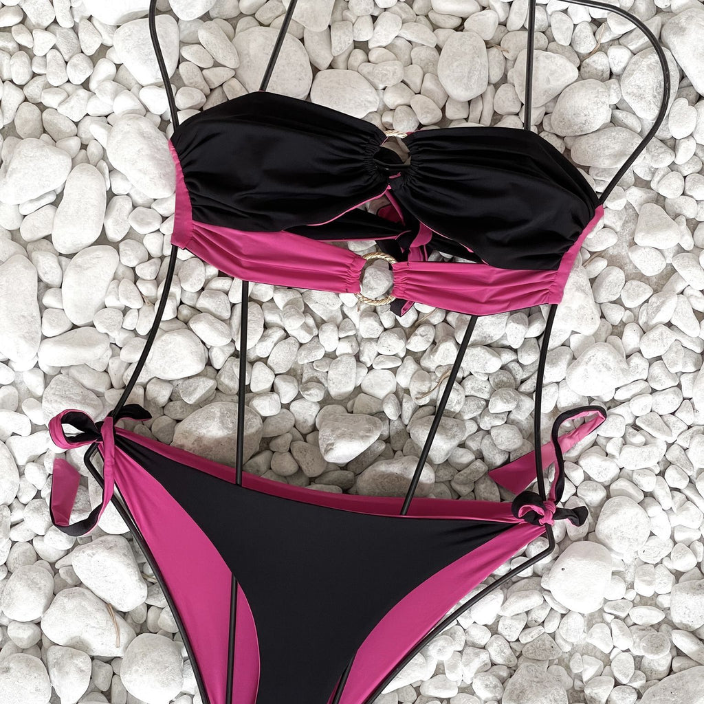 black and pink bikini on white pebbles black and pink bikini on white pebbles
