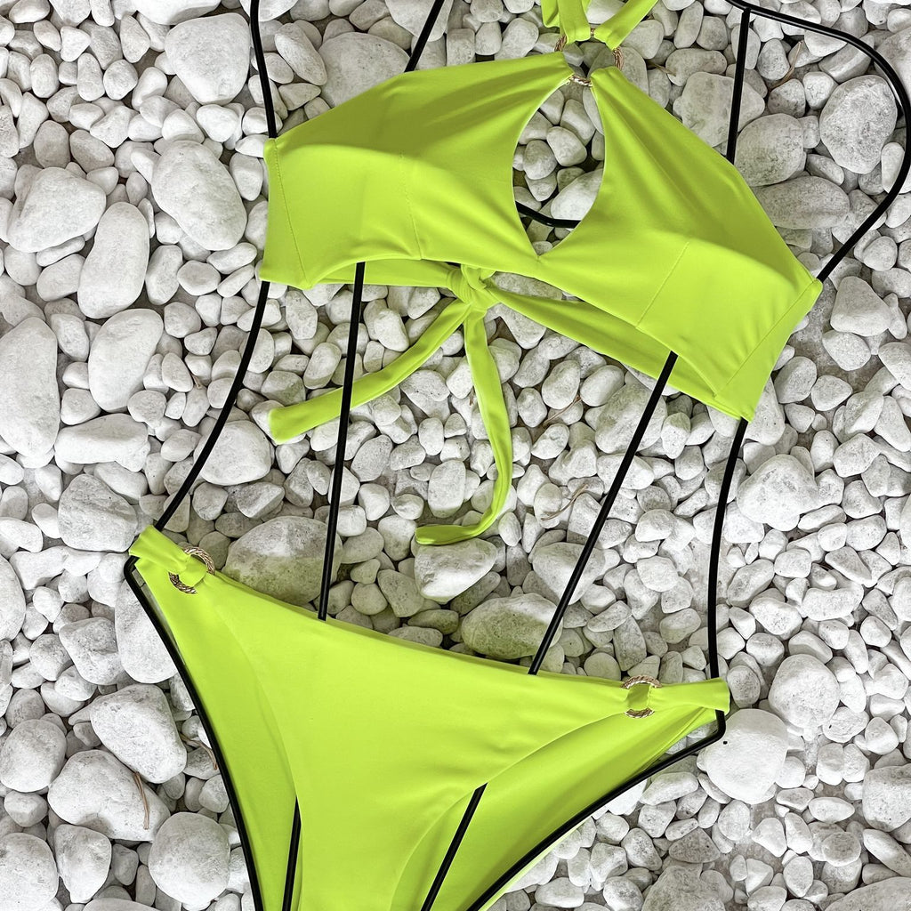 lime green swimsuit on white pebbles lime green swimsuit on white pebbles