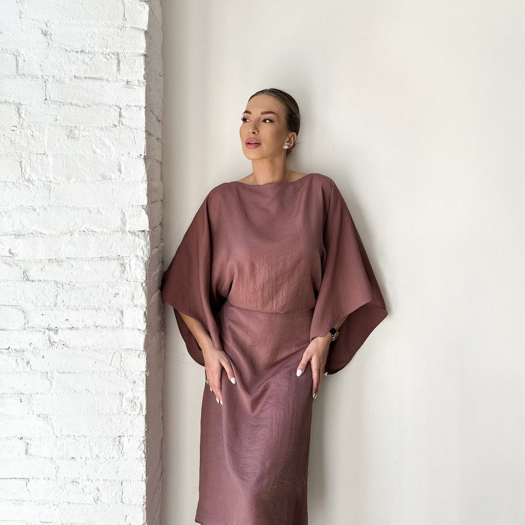 model wearing brown midi dress with wide sleeves model wearing brown midi dress with wide sleeves