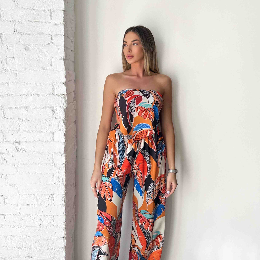 woman wearing colorful strapless jumpsuit woman wearing colorful strapless jumpsuit
