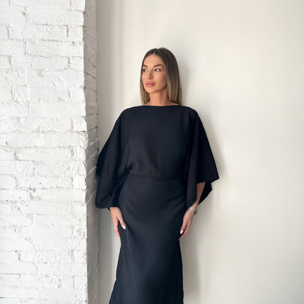 black batwing sleeve dress in white brick room black batwing sleeve dress in white brick room