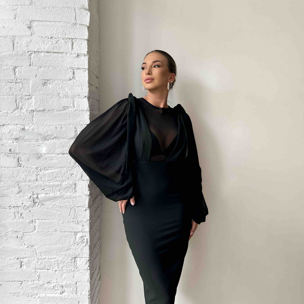 woman wearing black sleeve detail dress woman wearing black sleeve detail dress