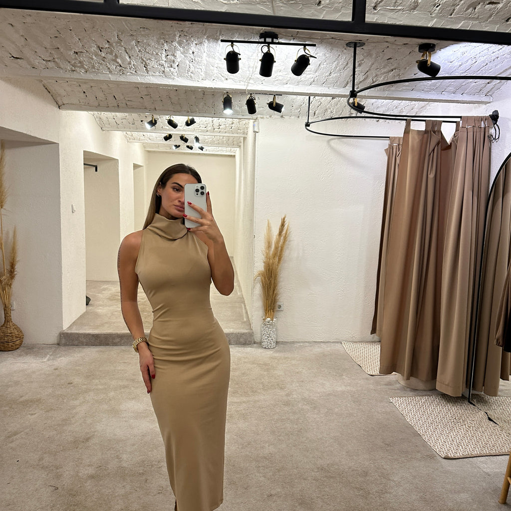 woman wearing beige sleeveless midi dress woman wearing beige sleeveless midi dress