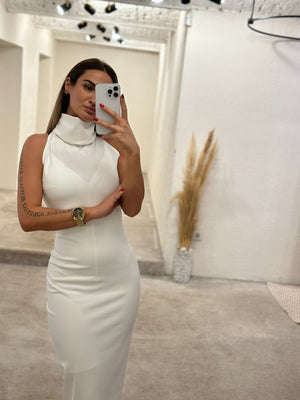 woman in white halter dress taking selfie woman in white halter dress taking selfie