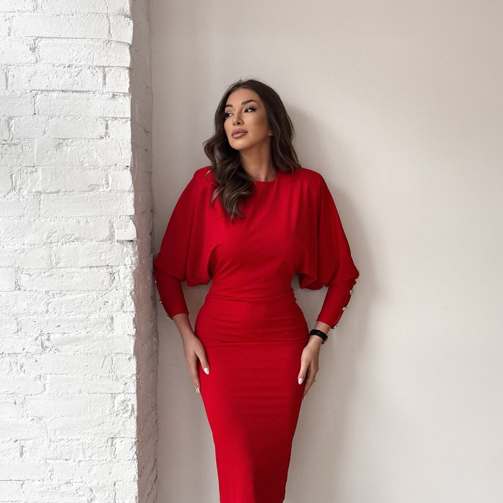 woman wearing red dress standing by white wall woman wearing red dress standing by white wall