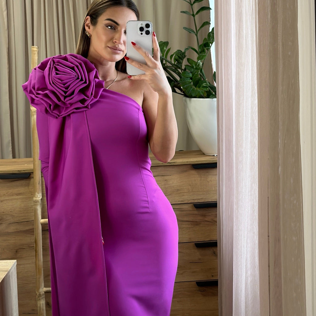 woman wearing one shoulder magenta dress with floral design woman wearing one shoulder magenta dress with floral design