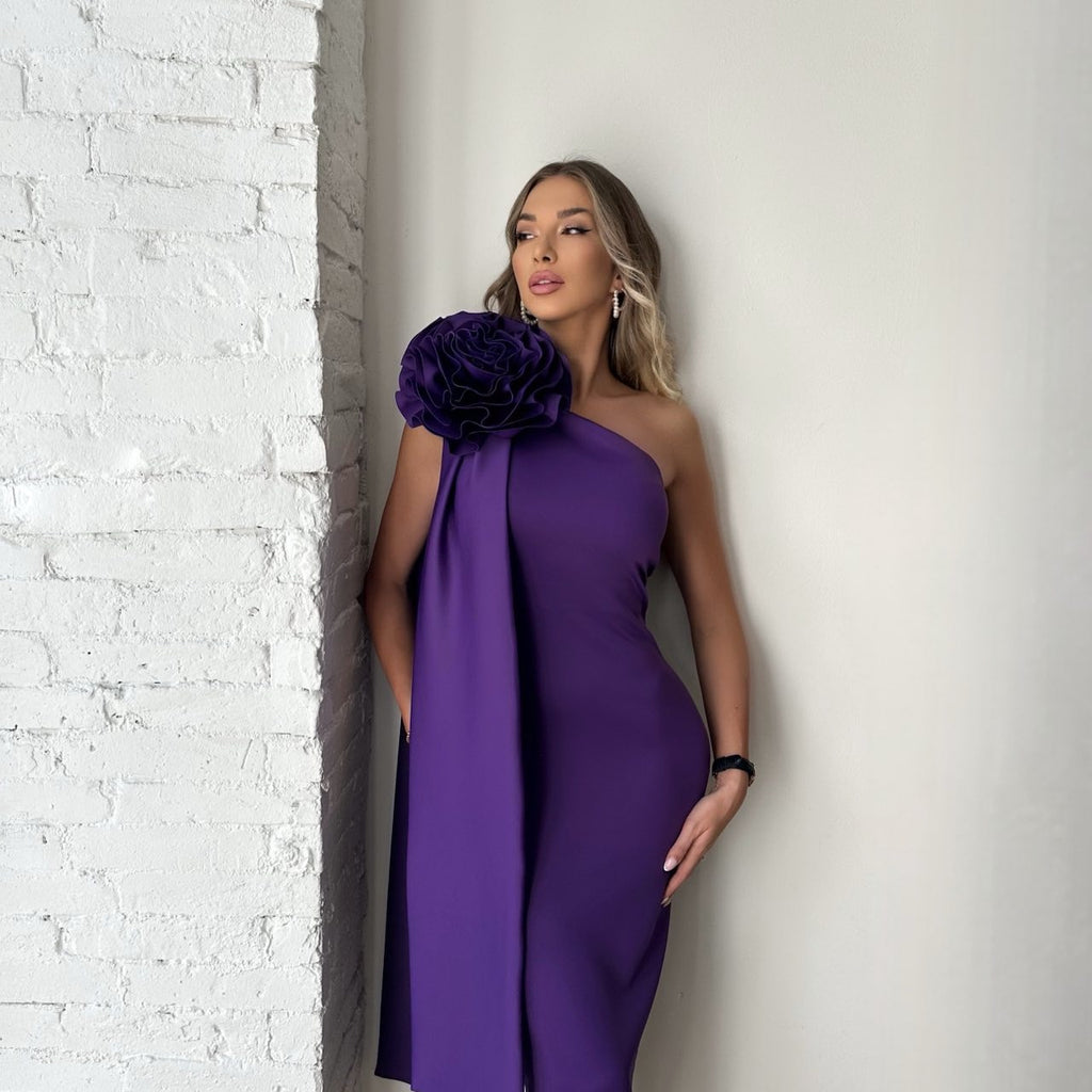 woman wearing purple one shoulder dress with floral detail woman wearing purple one shoulder dress with floral detail