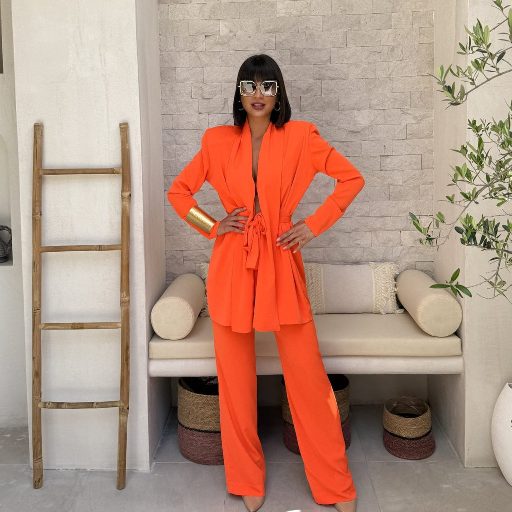 orange pantsuit outfit with sunglasses and gold bracelet orange pantsuit outfit with sunglasses and gold bracelet