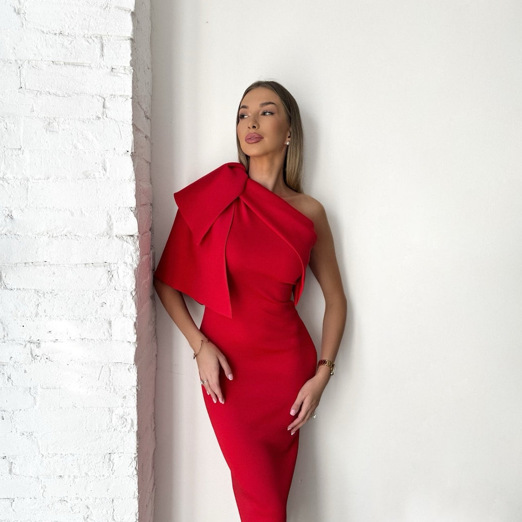 woman wearing red off shoulder dress with bow detail woman wearing red off shoulder dress with bow detail