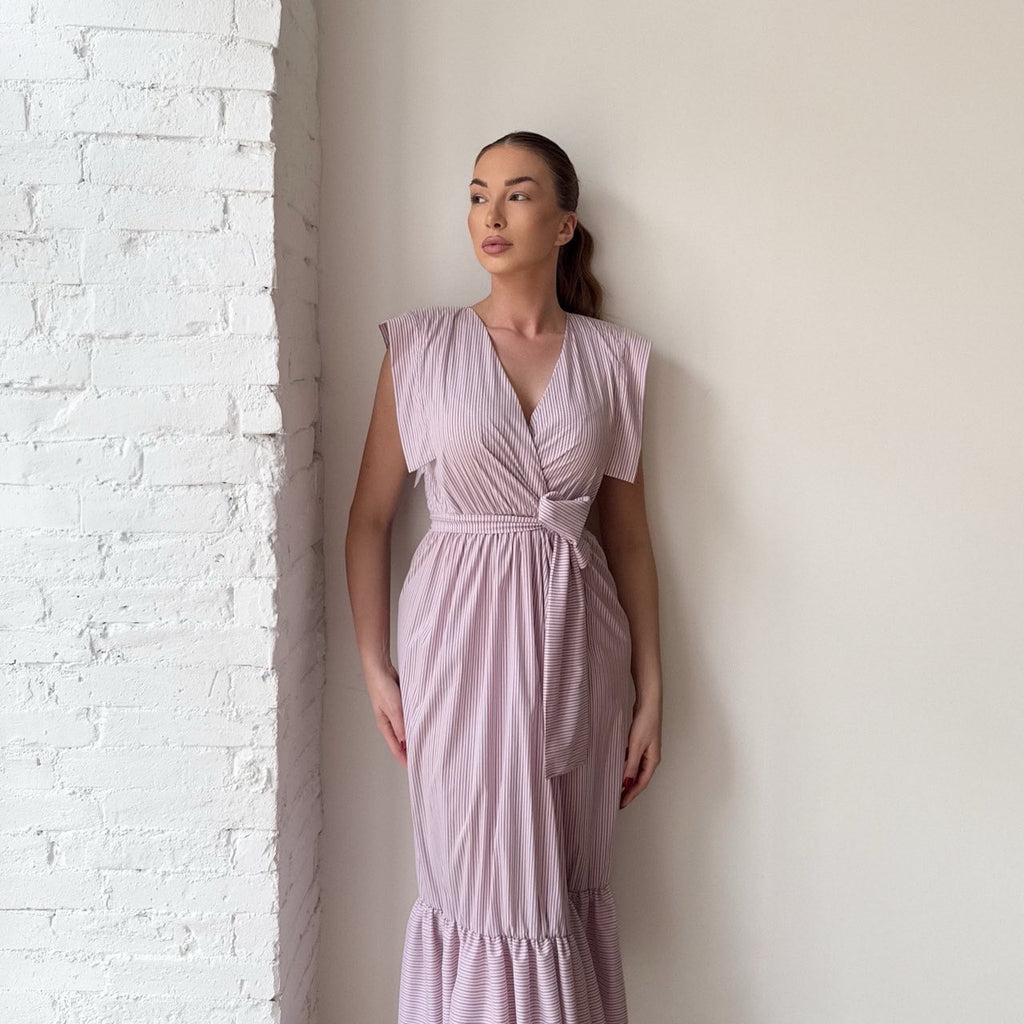 woman wearing pink striped midi dress woman wearing pink striped midi dress