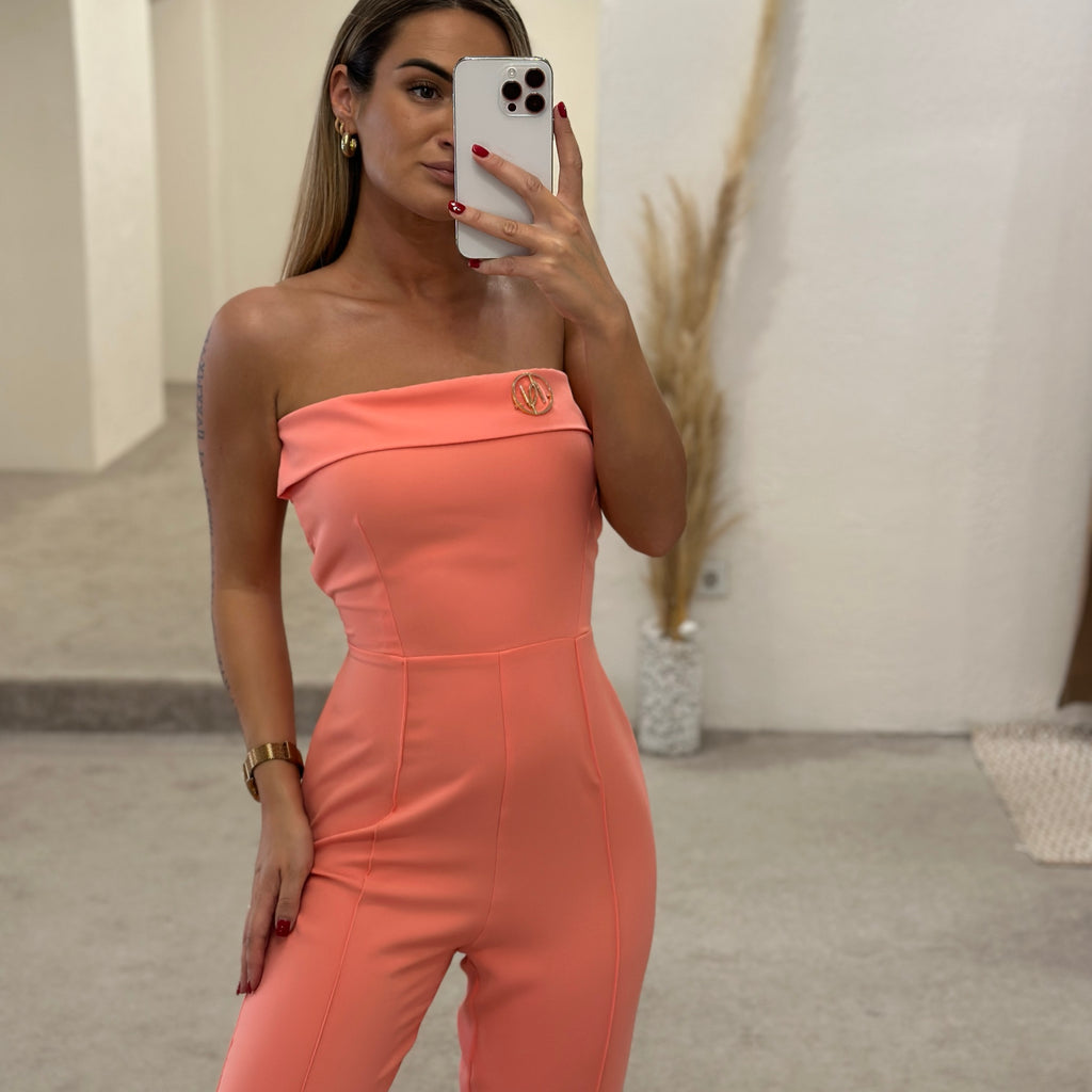 peach strapless jumpsuit model in showroom peach strapless jumpsuit model in showroom