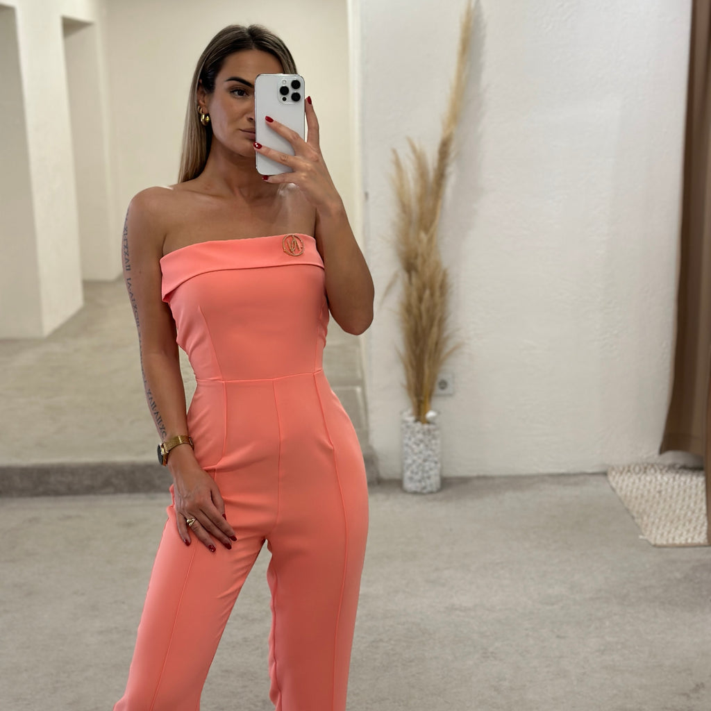 woman wearing peach off shoulder jumpsuit woman wearing peach off shoulder jumpsuit