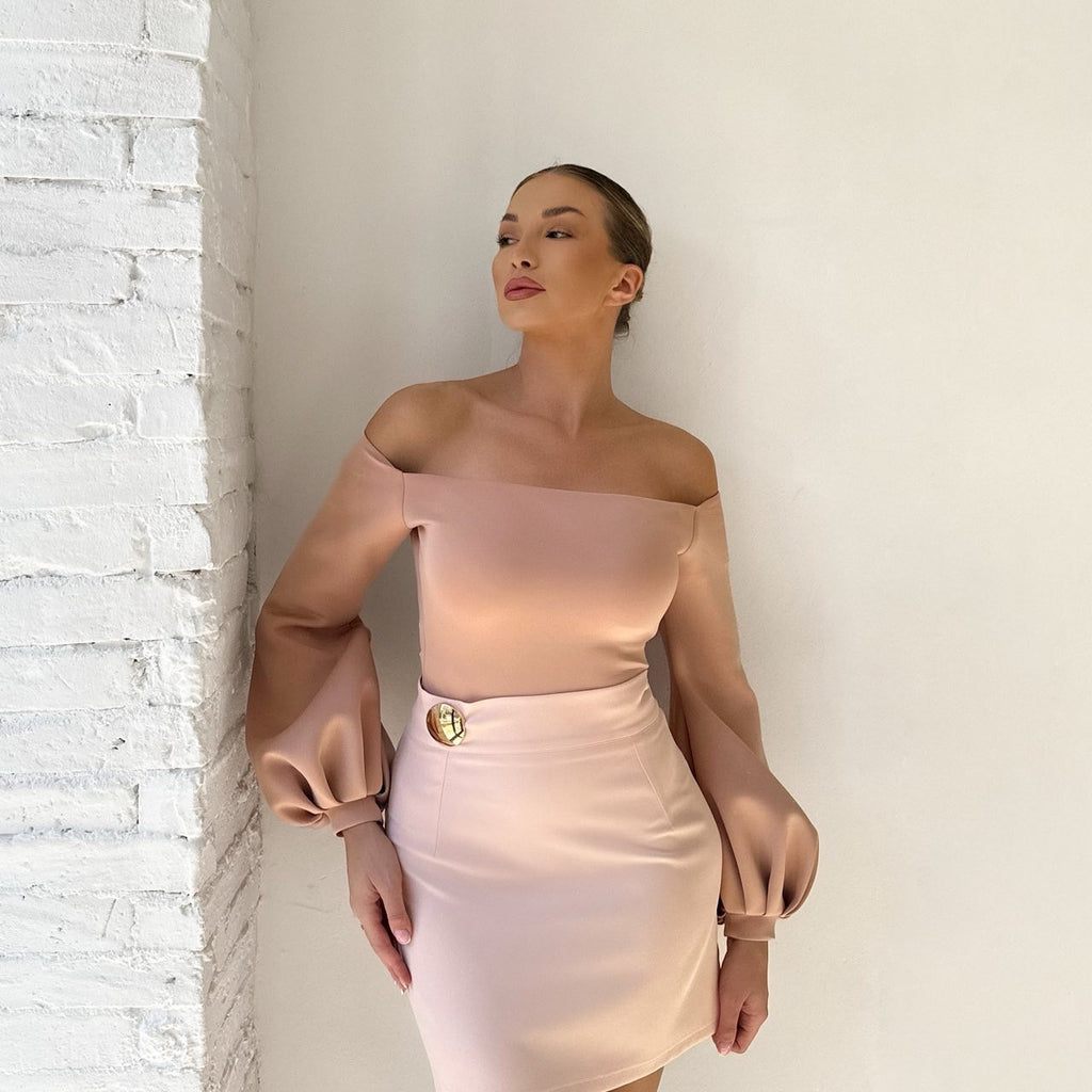 woman wearing pink off shoulder dress with bubble sleeves woman wearing pink off shoulder dress with bubble sleeves
