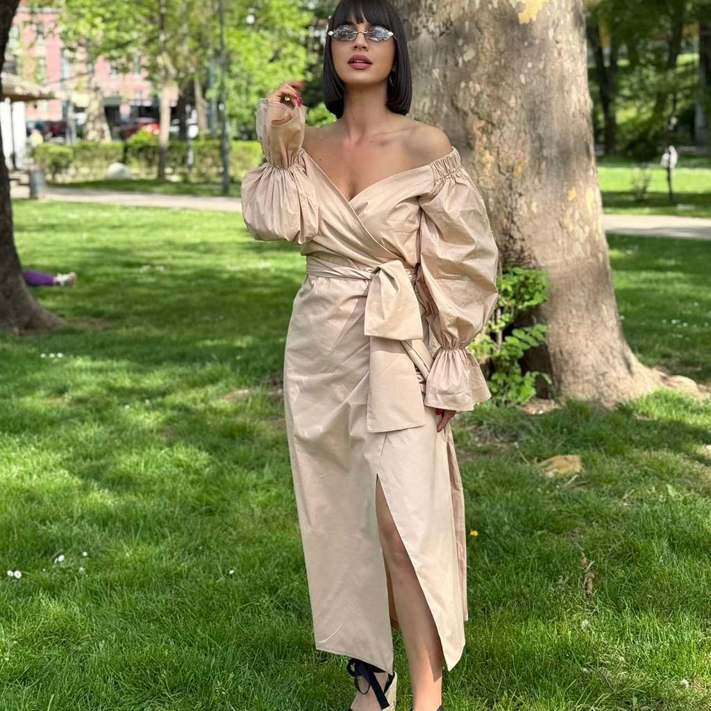 woman in beige off shoulder dress standing in park woman in beige off shoulder dress standing in park