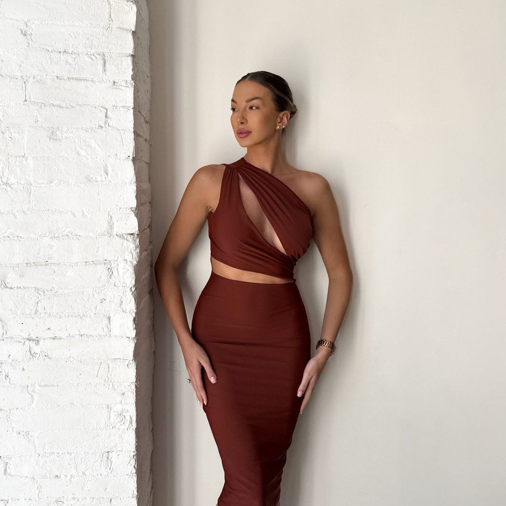 woman wearing brown cutout dress woman wearing brown cutout dress