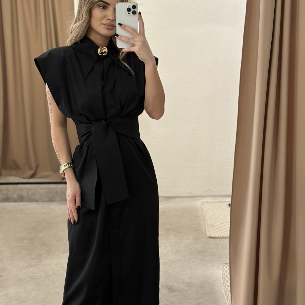 woman wearing black maxi dress taking mirror selfie woman wearing black maxi dress taking mirror selfie