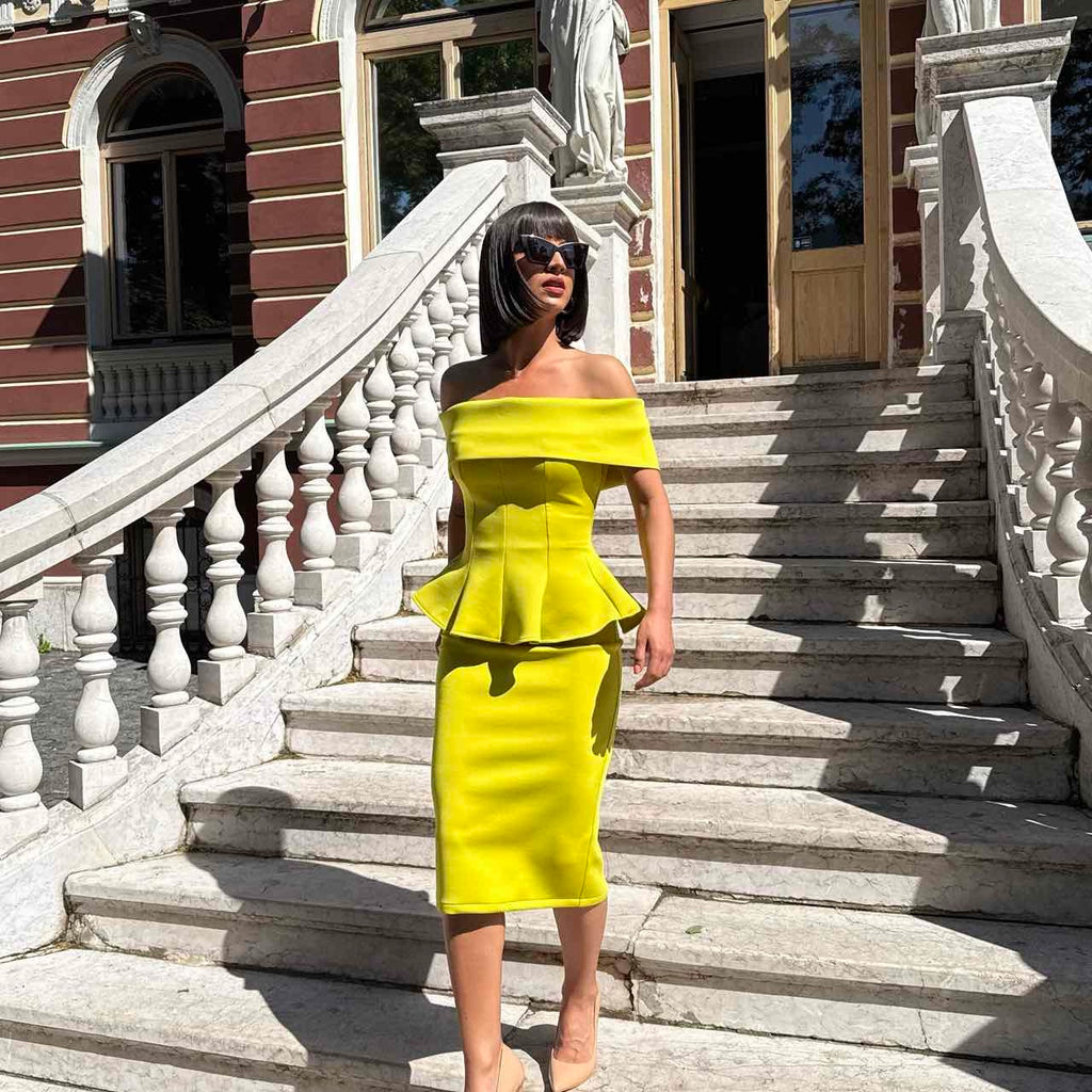 woman wearing off shoulder yellow dress on stairs woman wearing off shoulder yellow dress on stairs