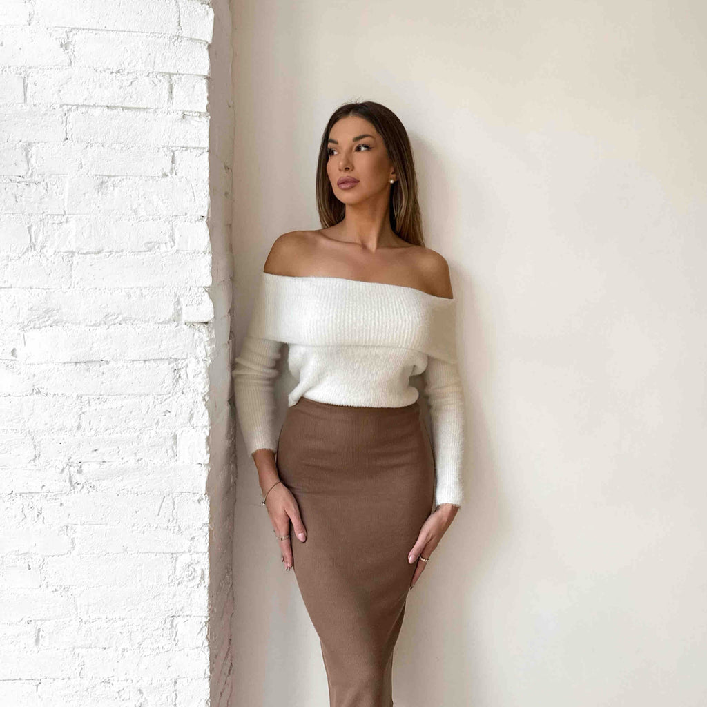 woman wearing off shoulder white top and brown midi skirt woman wearing off shoulder white top and brown midi skirt