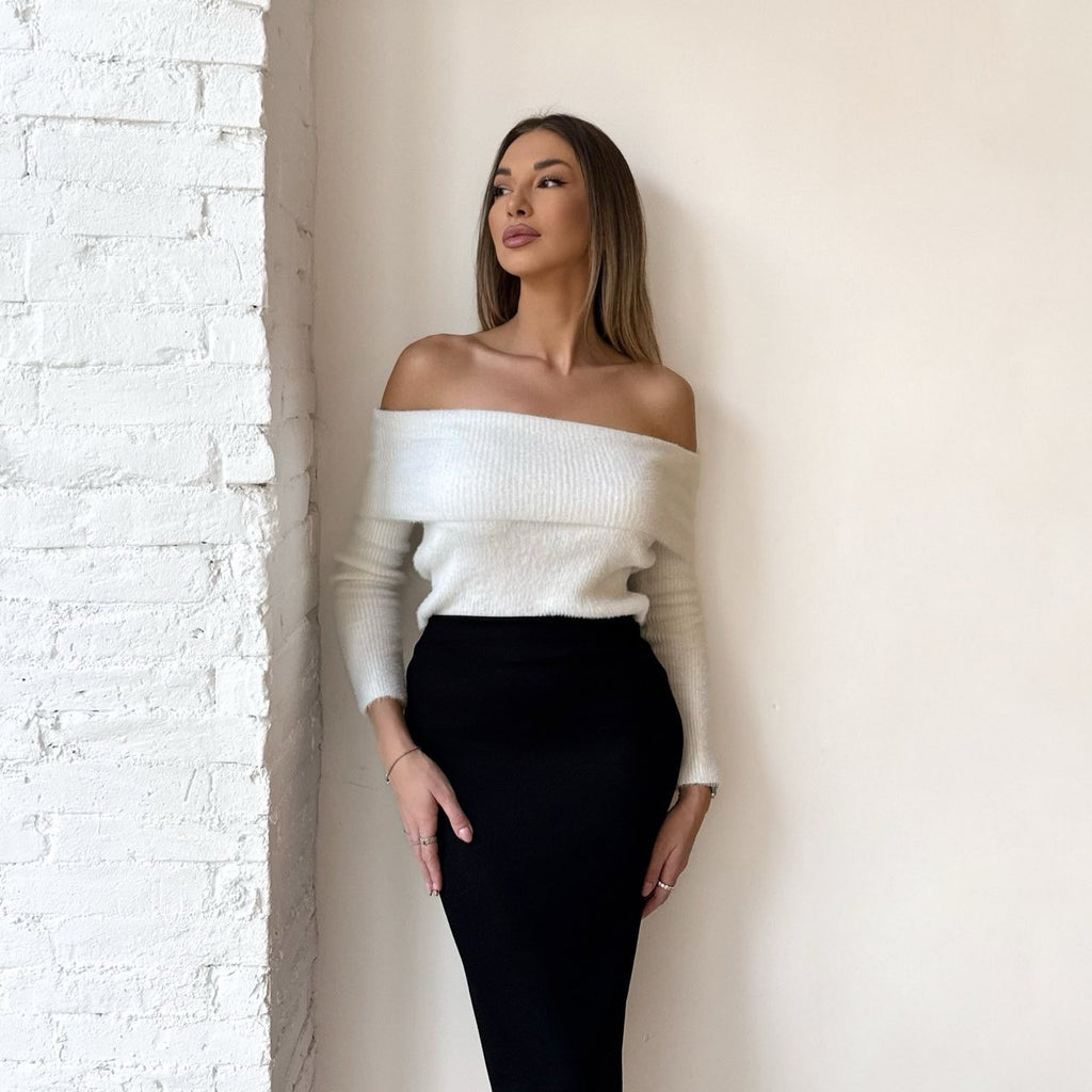 woman wearing off shoulder sweater and black skirt woman wearing off shoulder sweater and black skirt