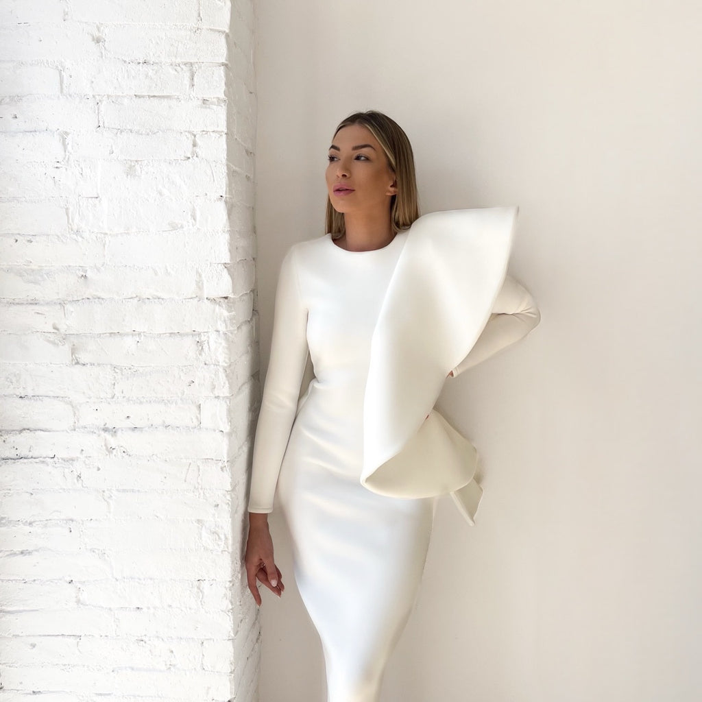 white sleeveless dress with elegant ruffle design white sleeveless dress with elegant ruffle design