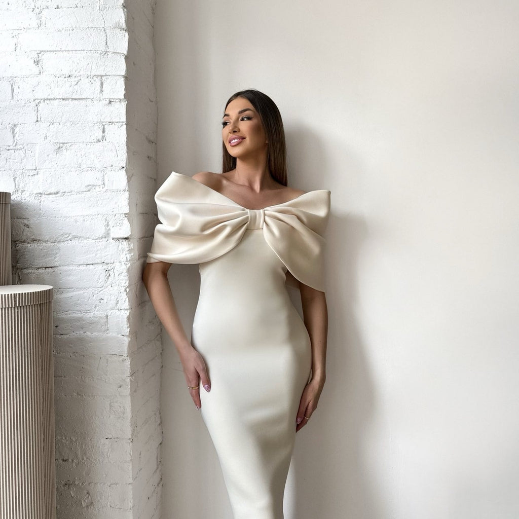 elegant cream dress with large bow design elegant cream dress with large bow design