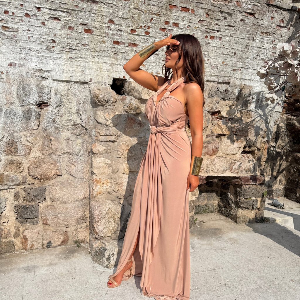 woman in beige maxi dress standing outside woman in beige maxi dress standing outside