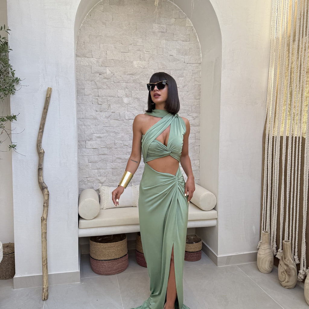 woman wearing green maxi dress with side slit woman wearing green maxi dress with side slit