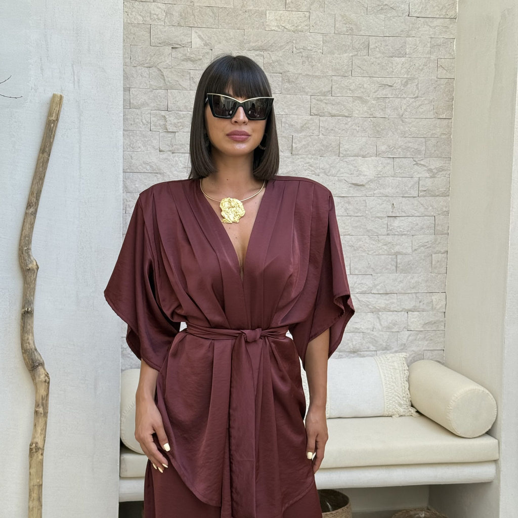 woman in maroon kimono dress and sunglasses woman in maroon kimono dress and sunglasses