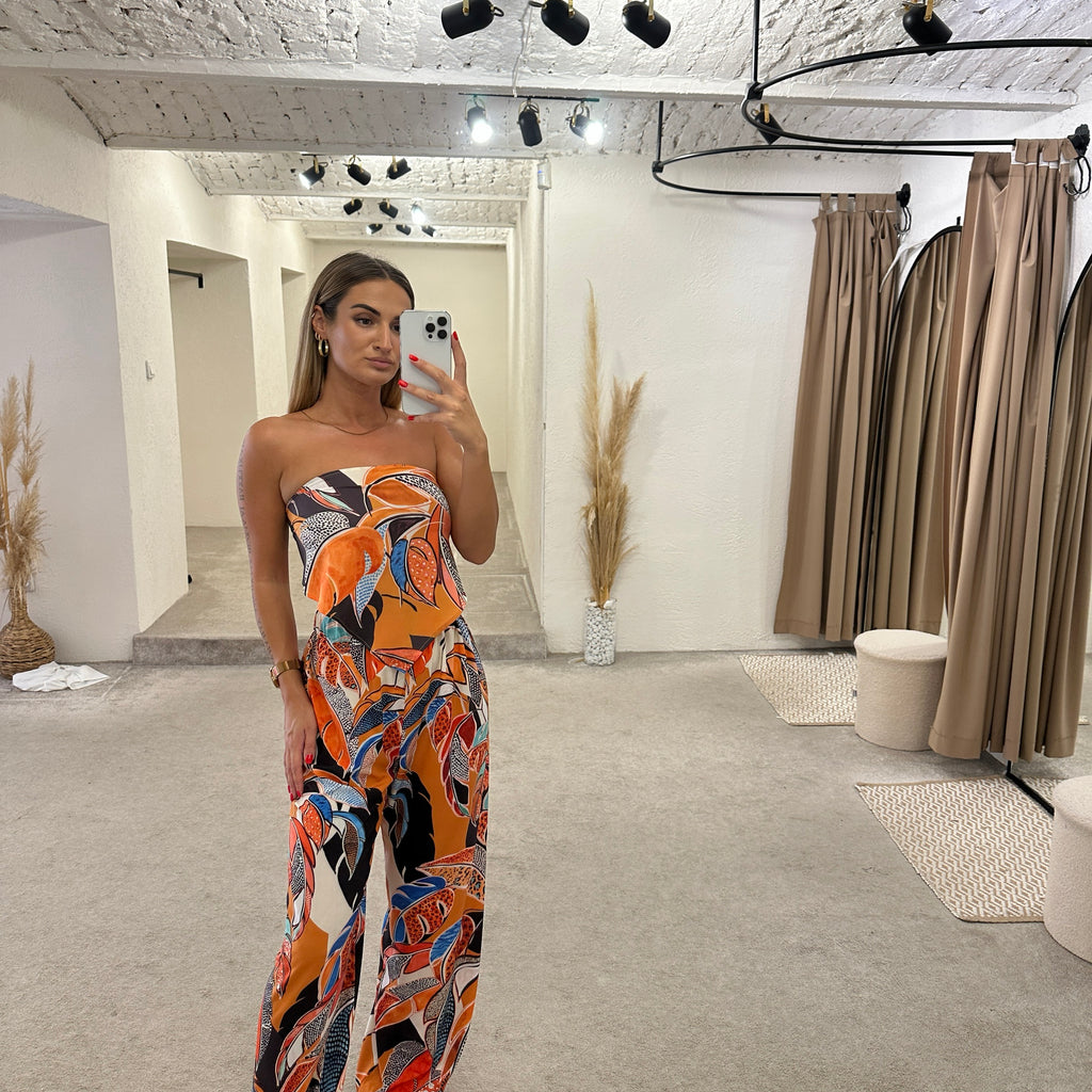 woman wearing colorful strapless dress woman wearing colorful strapless dress