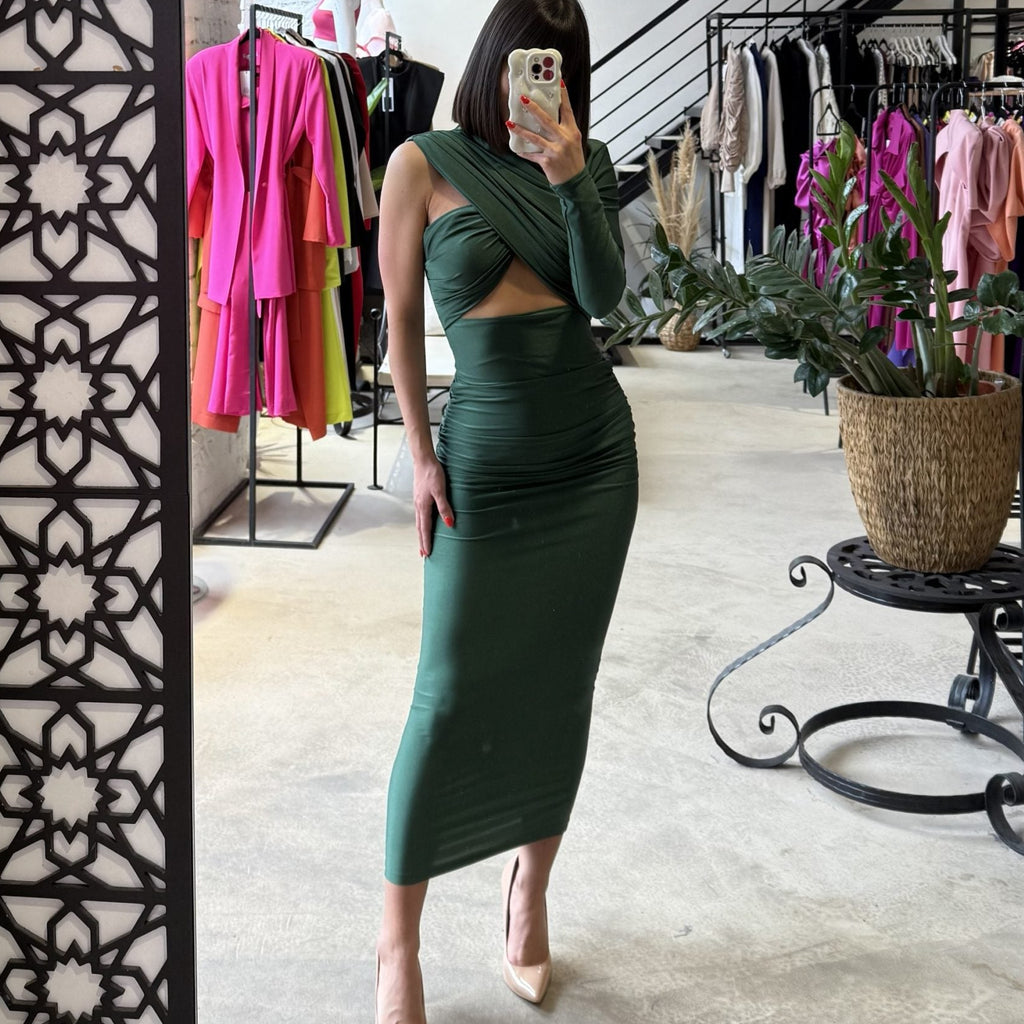 woman in green cutout dress in boutique woman in green cutout dress in boutique