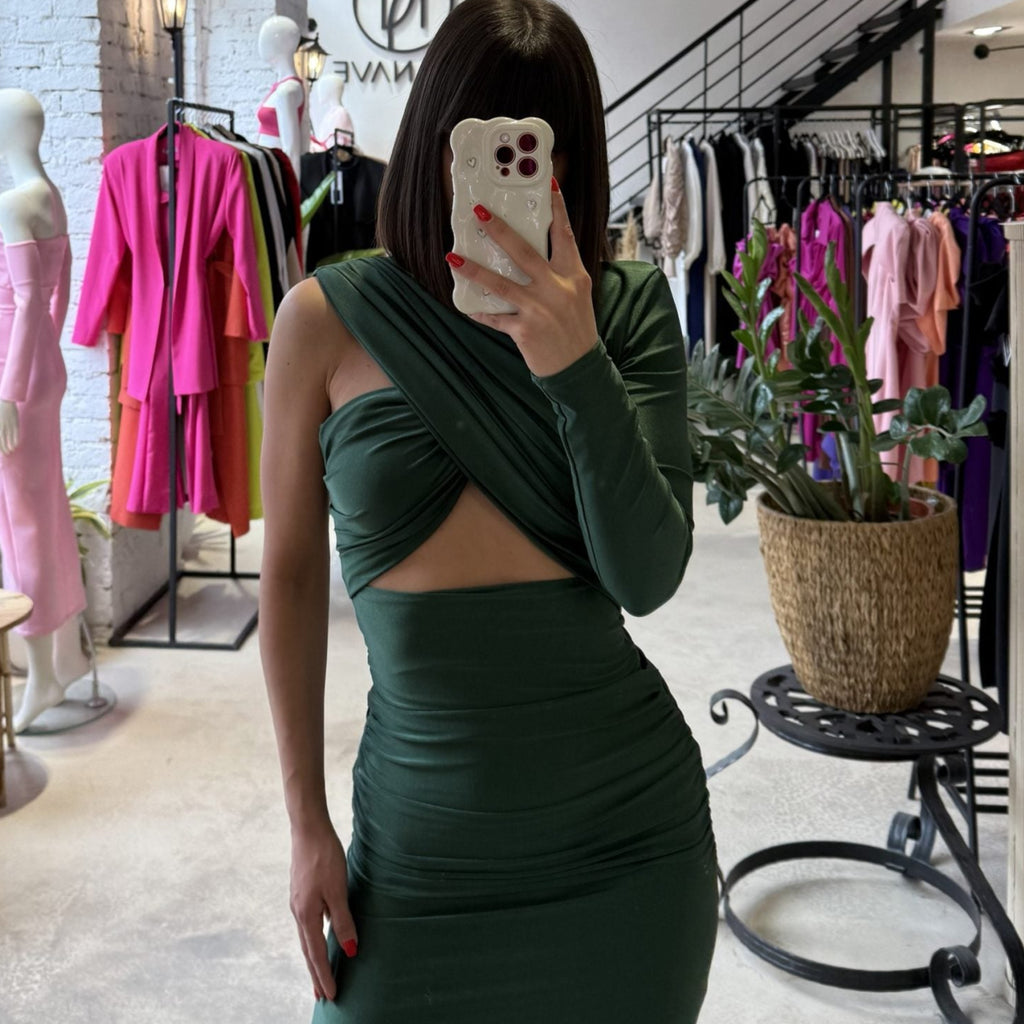 woman in green dress in boutique woman in green dress in boutique